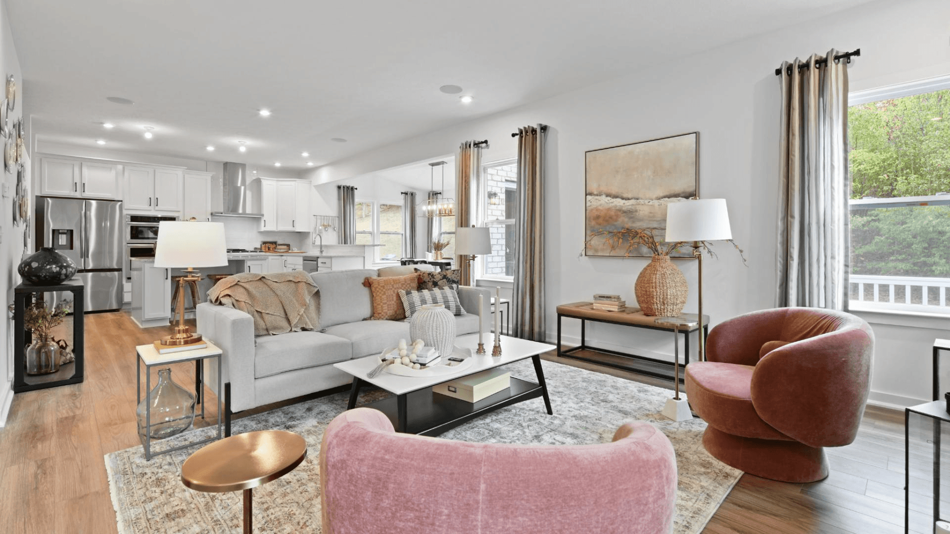 Open floor plans seamlessly blend the family room, kitchen, and sunroom for a spacious feel.