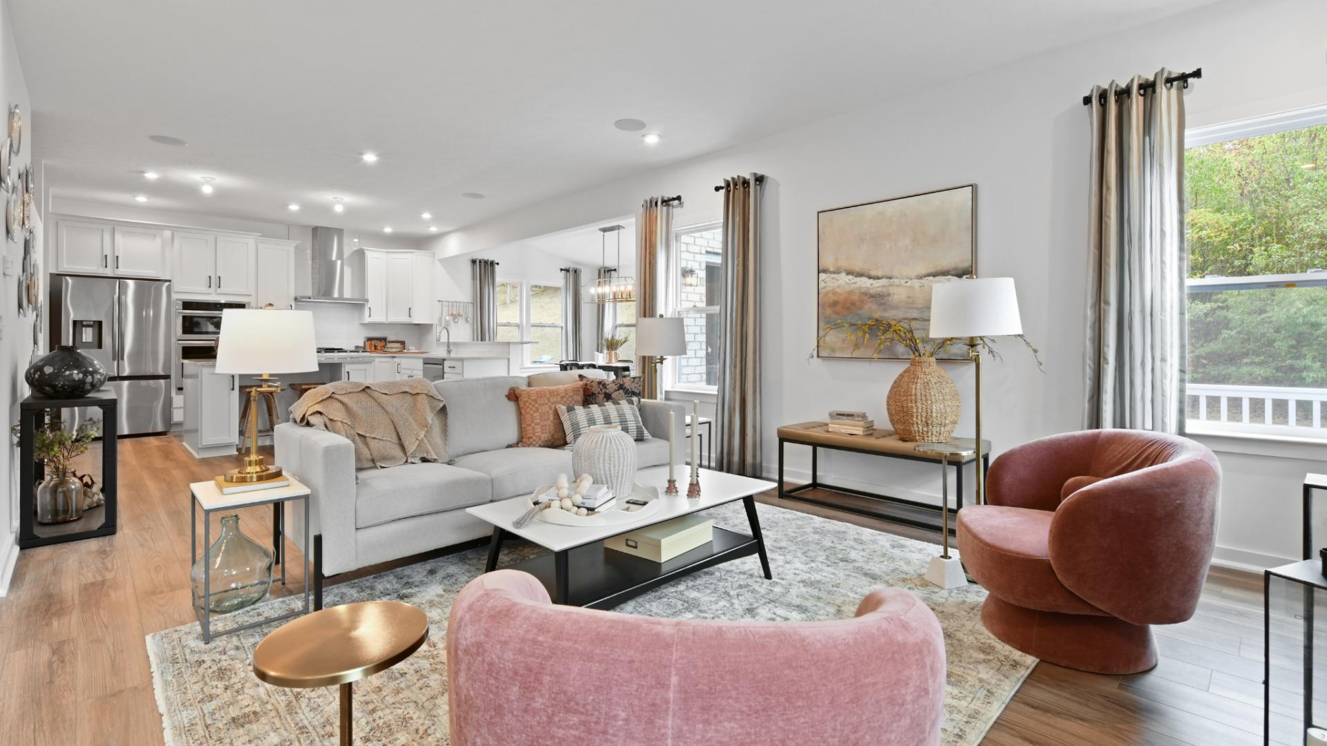 Open floor plans seamlessly blend the family room, kitchen, and sunroom for a spacious feel.