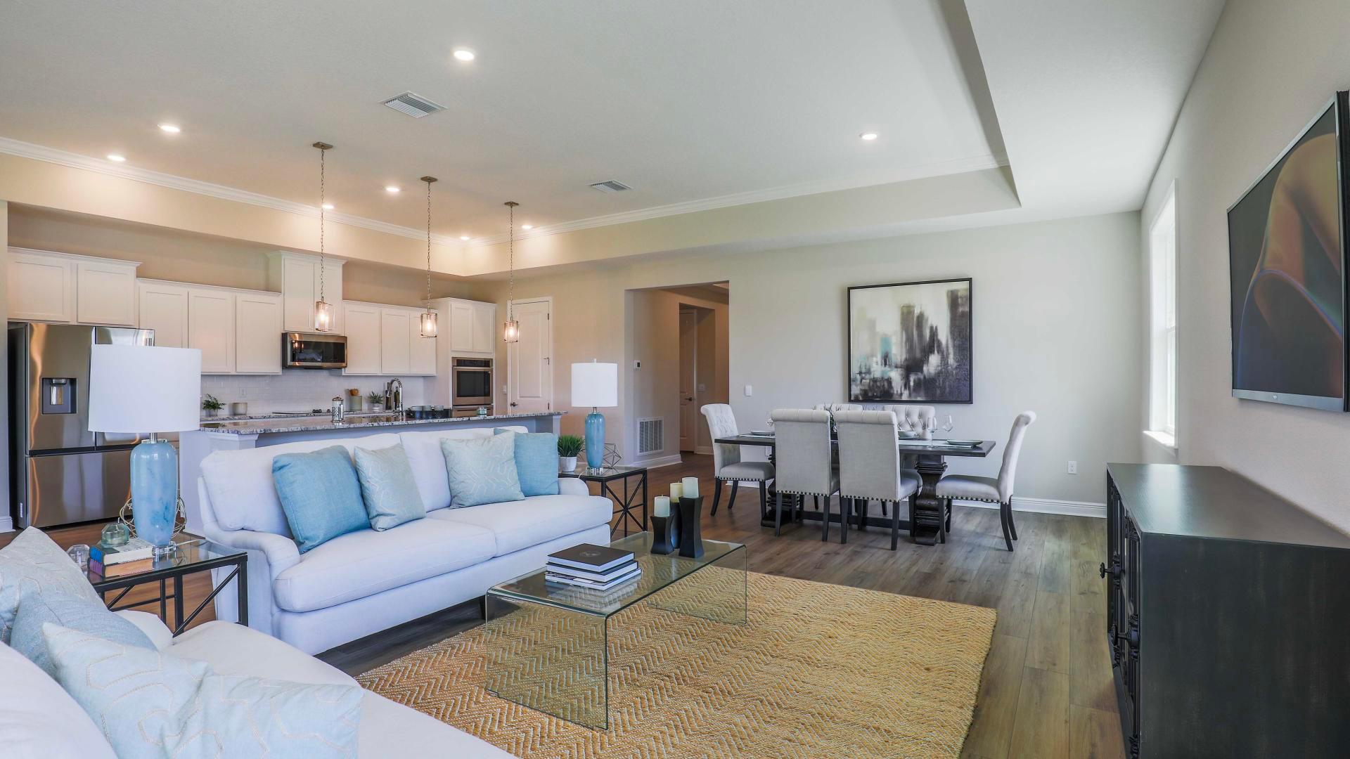 Open-concept home designs make it easy to help with homework or entertain guests.