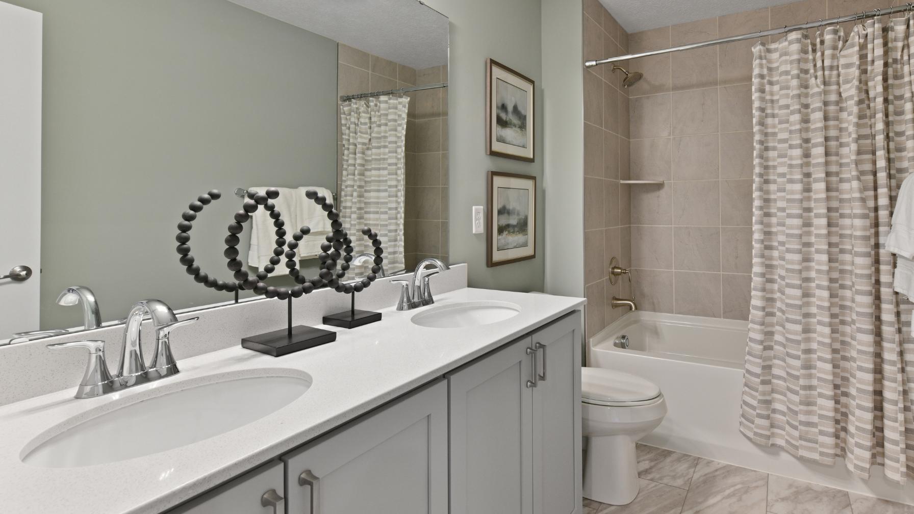 With the option of multiple baths in your new home, everyone can have their own space to get ready.