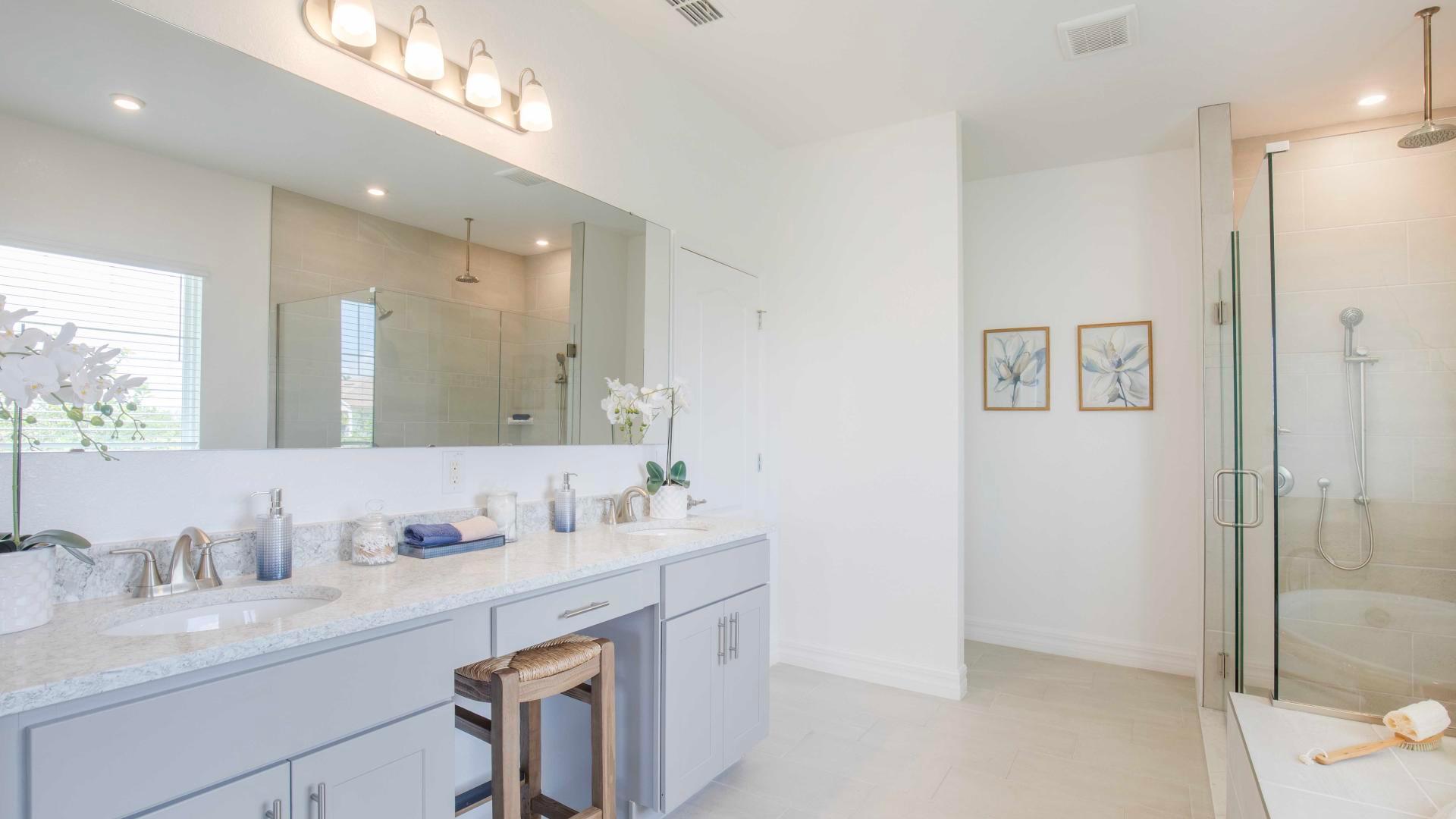 Dual vanities, walk-in tile surround showers and plenty of storage gives the master bath a spa like feel.