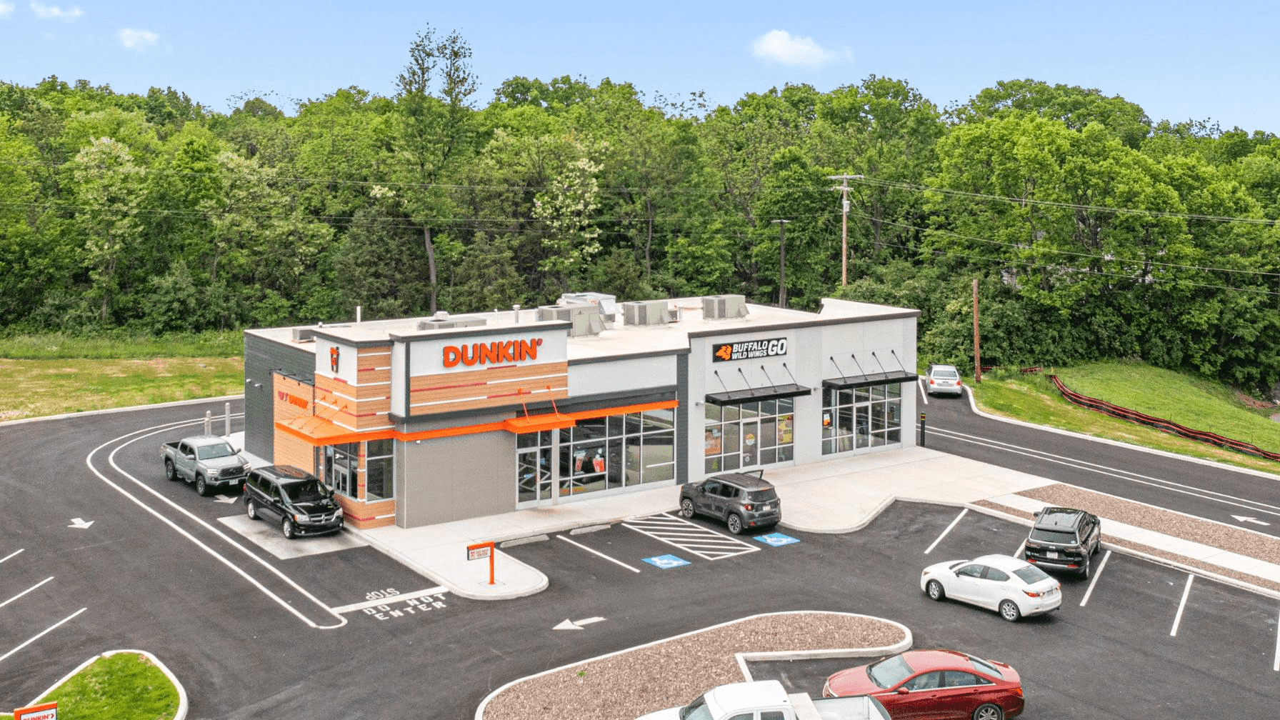 Dunkin Donuts is nearby for a morning coffee run.