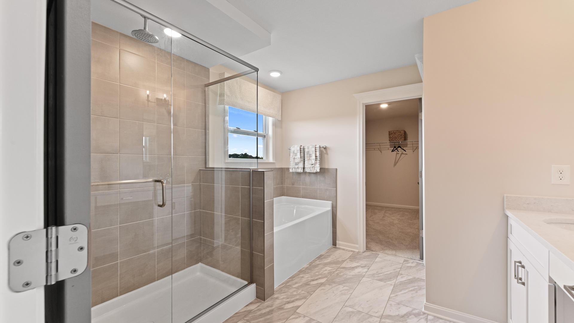 Double vanities, space to breathe, and a touch of spa-like peace.