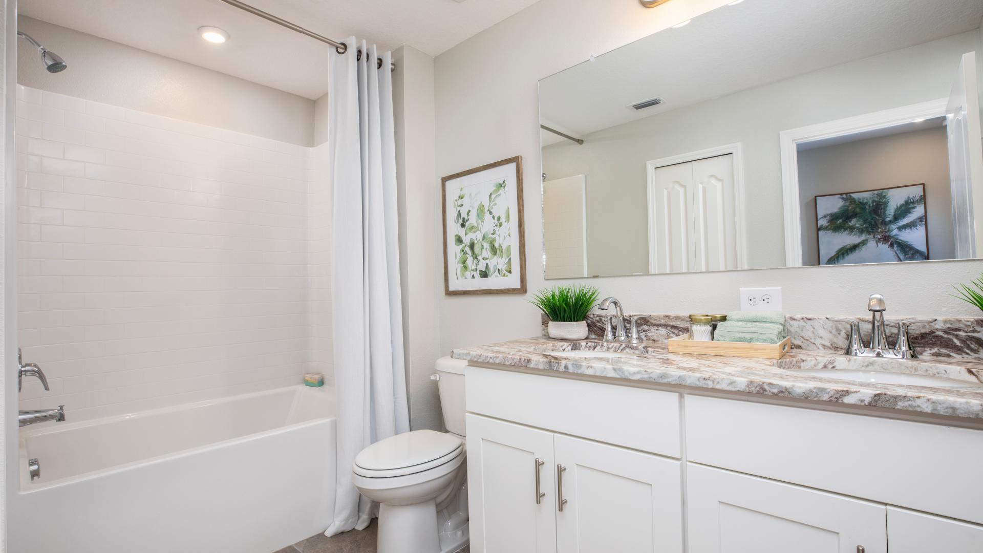 Friends and family will love the double vanity and convenient tub/shower combo for freshening up.