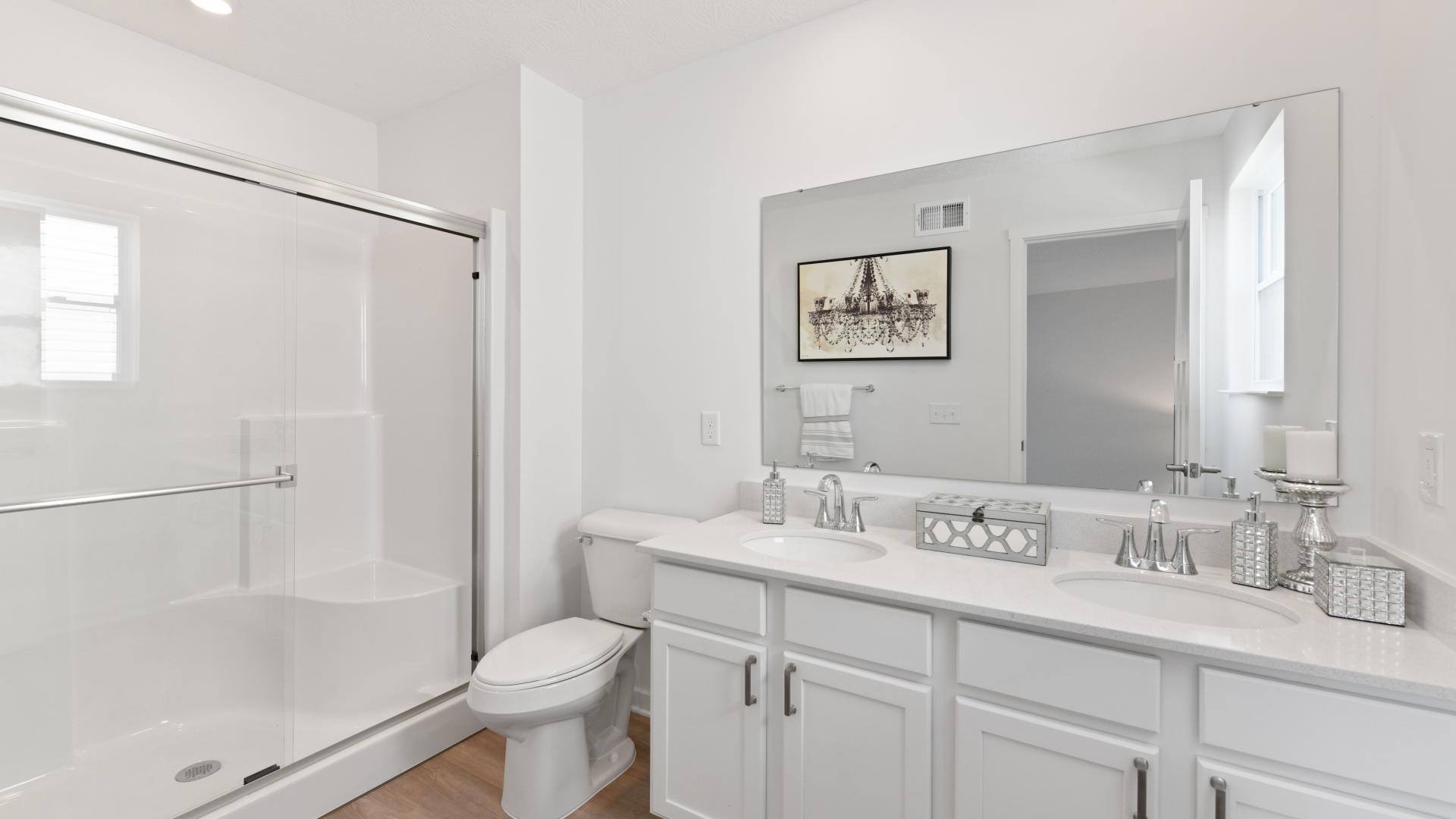 Dual vanities and walk-in shower makes getting ready in the morning easy.