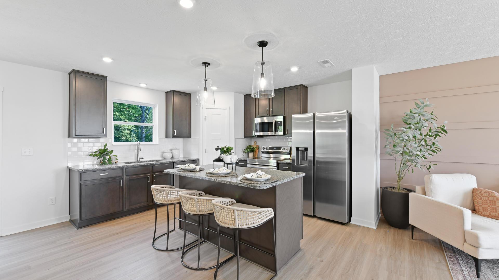Your new kitchen will feature stainless steel appliances and a spacious island for cooking and entertaining.