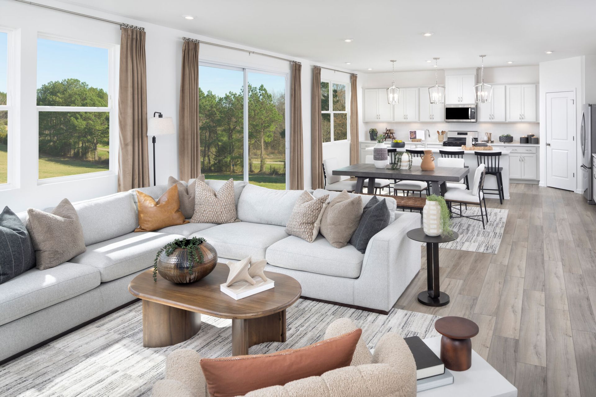 Sequoia model great room, dining area and kitchen.