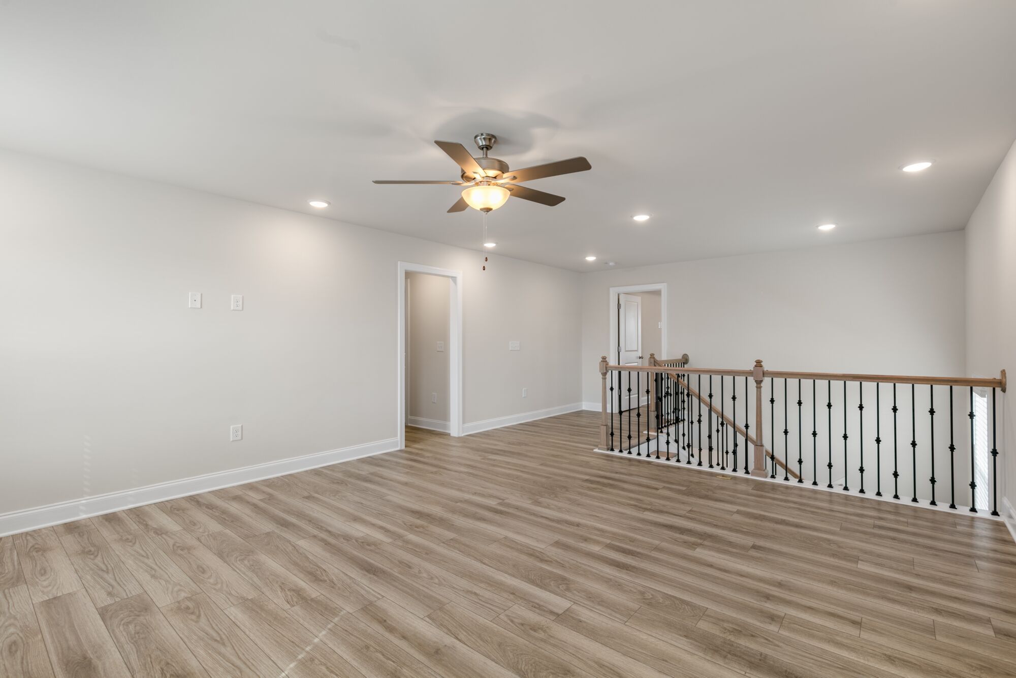 Loft - shown w/ enhanced vinyl plank flooring and open rails
