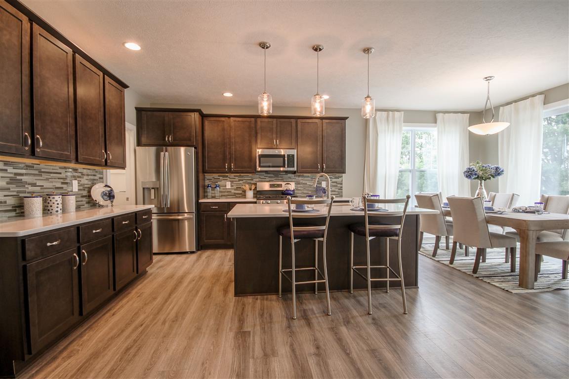 Welcome to the Norway. This fabulous new floor plan has a little bit of everything. A spacious foyer offers access to the guest suite, the study and the living area of the home. The open concept of the Great Room, Formal Dining, Cafe and gourmet kitchen, 