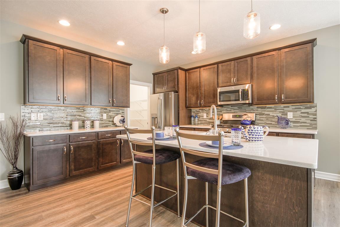Welcome to the Norway. This fabulous new floor plan has a little bit of everything. A spacious foyer offers access to the guest suite, the study and the living area of the home. The open concept of the Great Room, Formal Dining, Cafe and gourmet kitchen, 