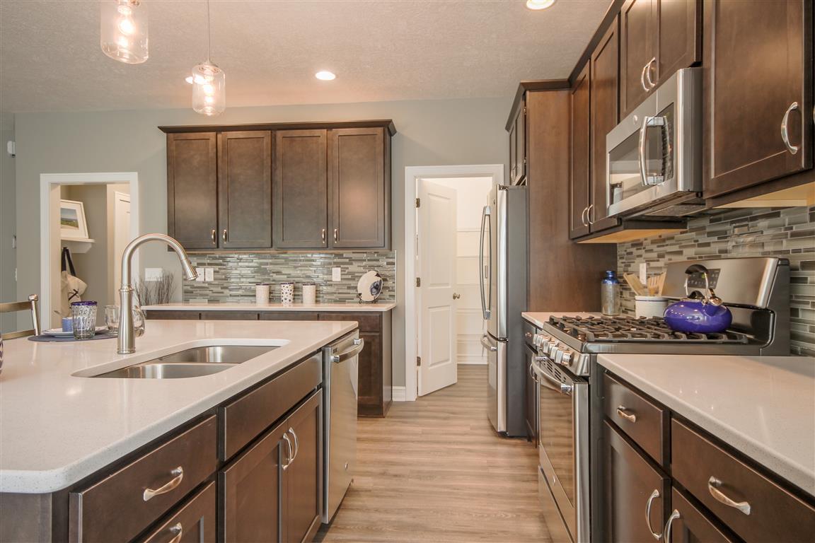 Welcome to the Norway. This fabulous new floor plan has a little bit of everything. A spacious foyer offers access to the guest suite, the study and the living area of the home. The open concept of the Great Room, Formal Dining, Cafe and gourmet kitchen, 