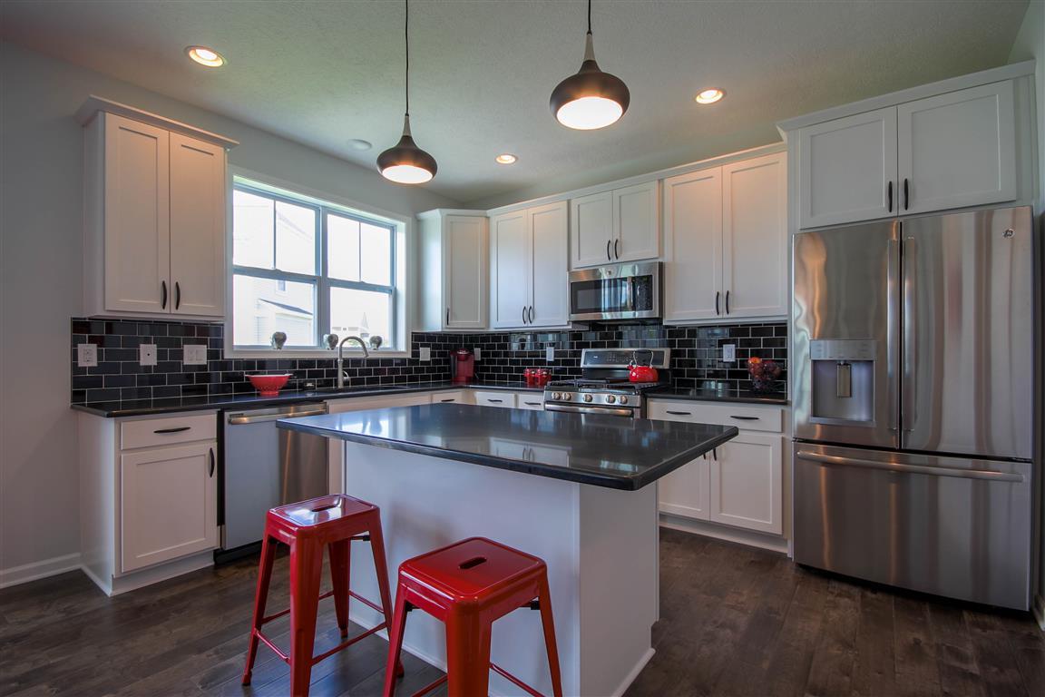 Welcome to the Newton. This home has a little bit of everything - from the first floor flex room (which can be a den or a bedroom) to the spacious Great Room, to the oversized dining area and well appointed kitchen, you will find it offers just what you n