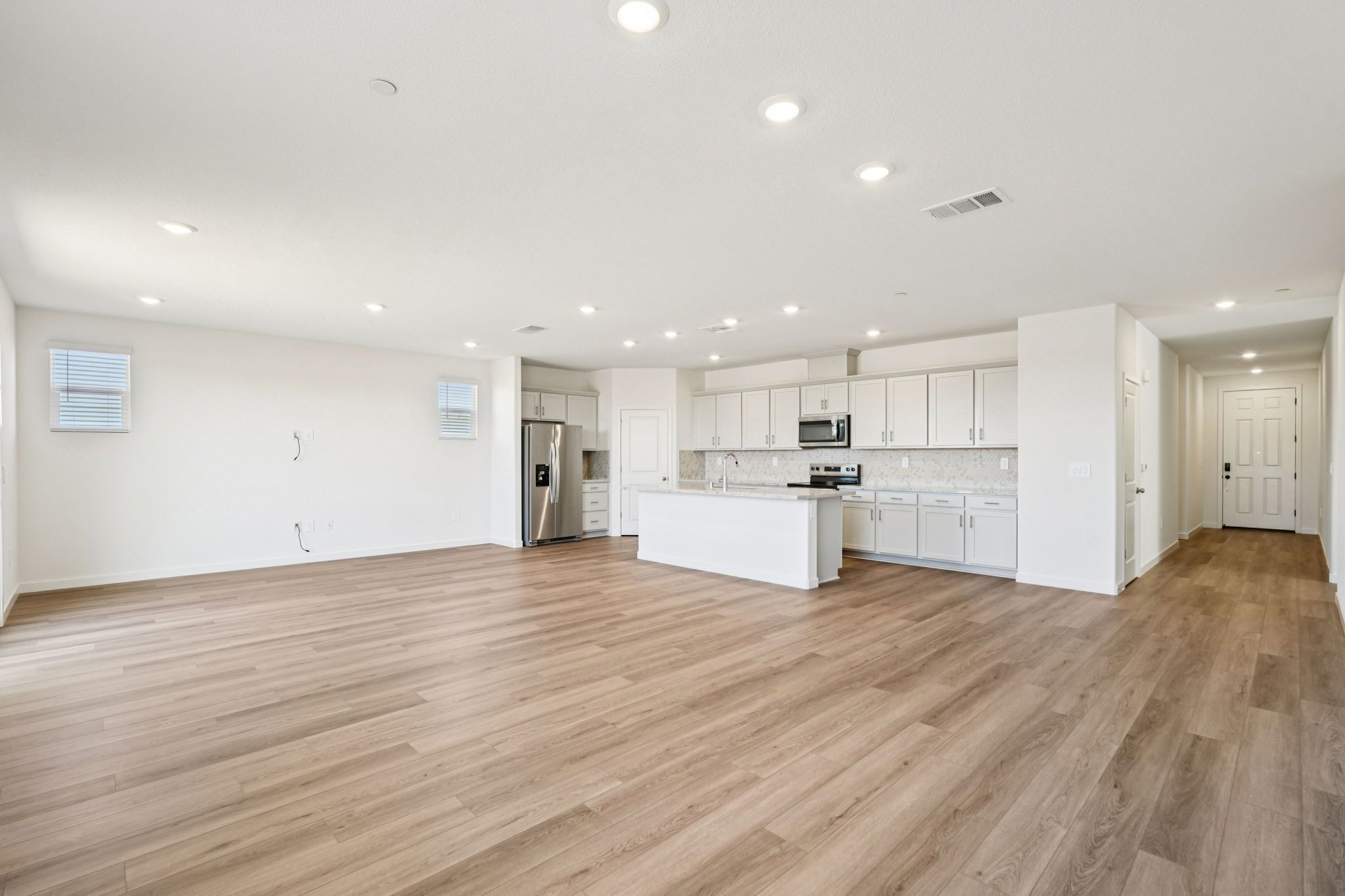 Residence 1 Open Concept kitchen, dining, and living room.