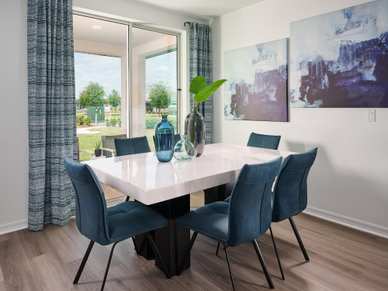 Dining room in Hibiscus floorplan modeled at The Reserve at Twin Lakes
