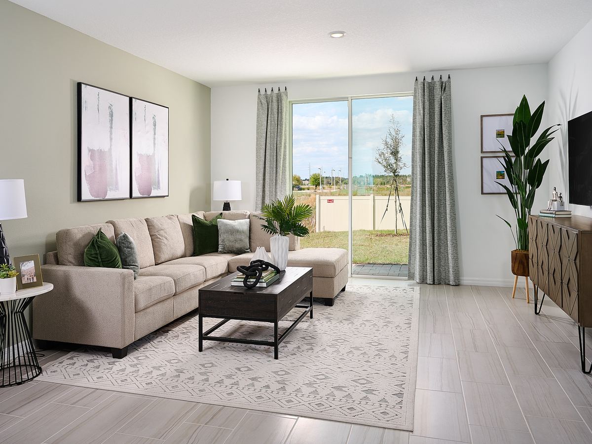 Family room in Acadia floorplan modeled at Lake Deer Estates