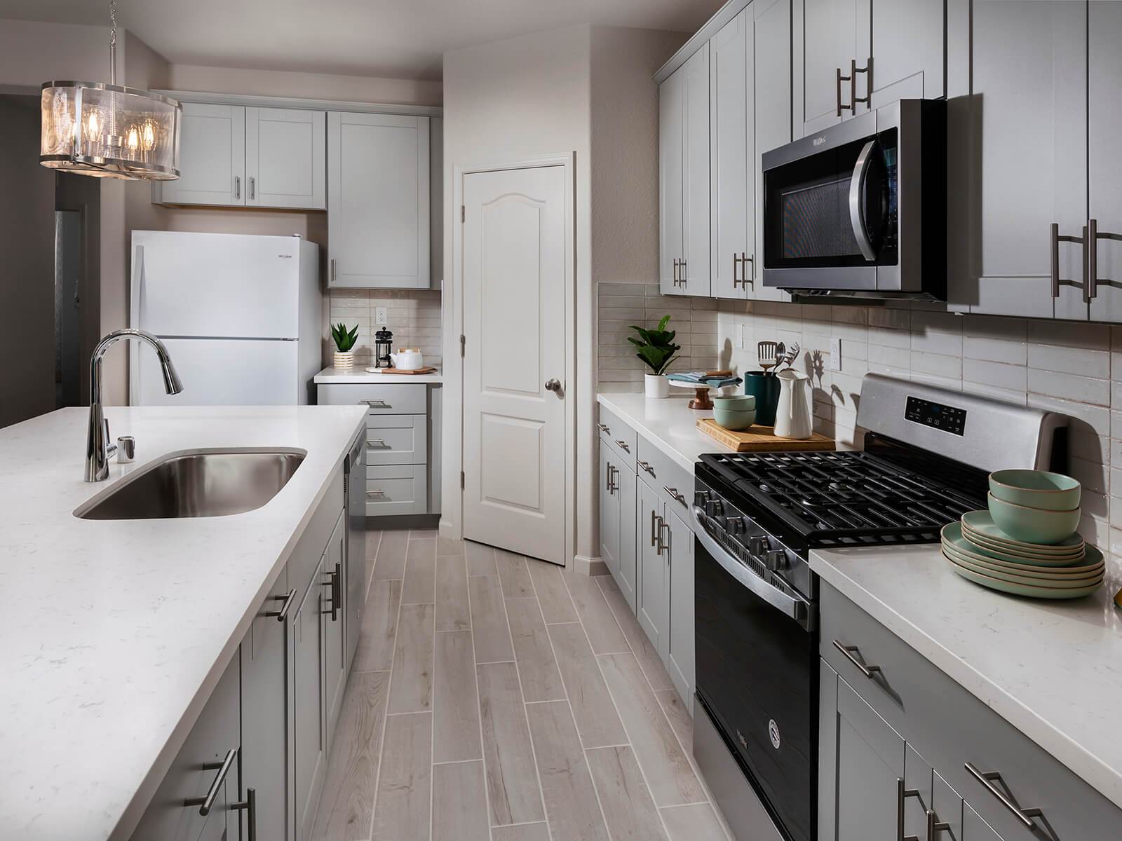 Residence 1 kitchen modeled at a nearby Meritage community.