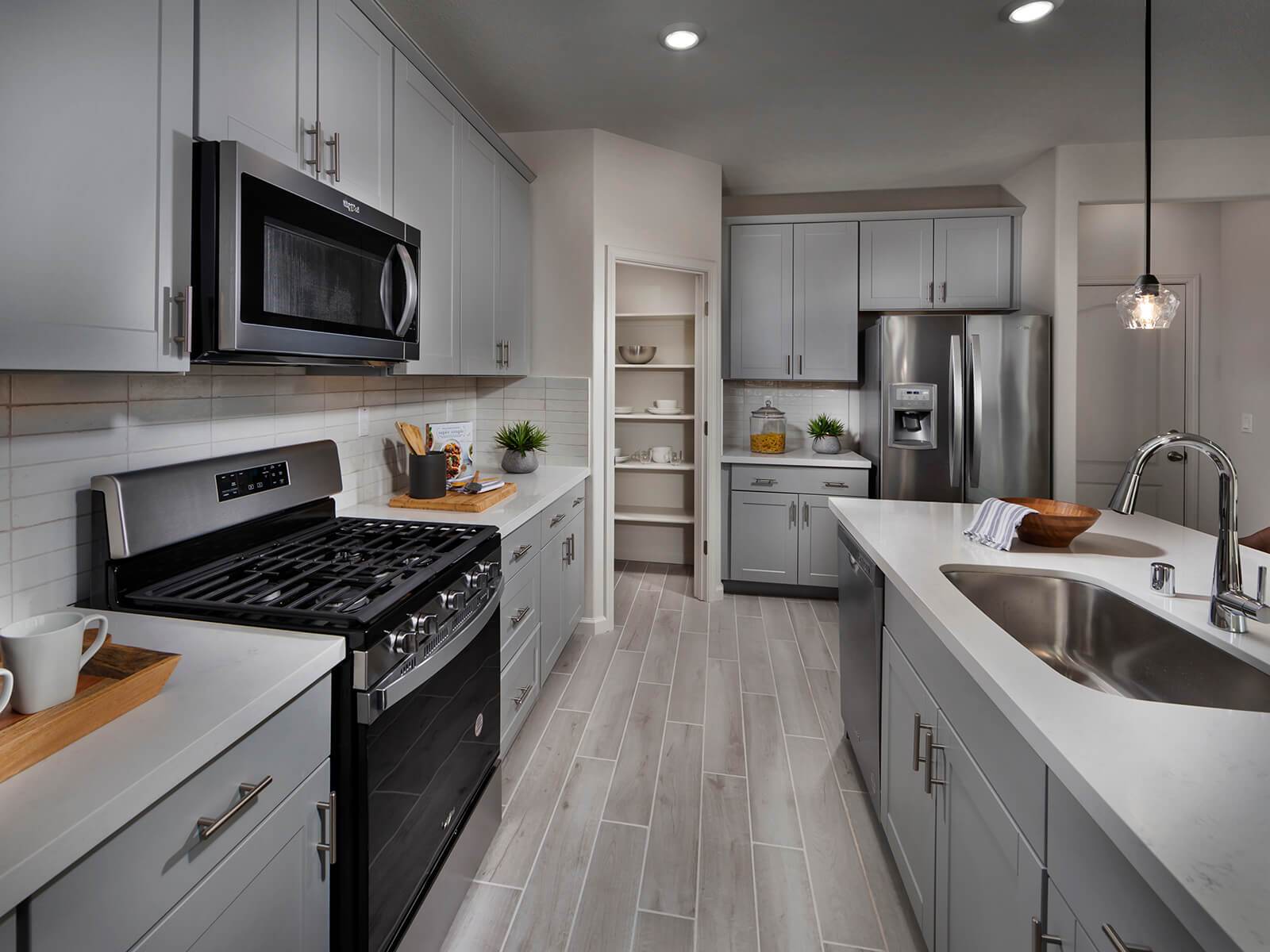 Keep organized with the spacious walk-in pantry and expansive island.