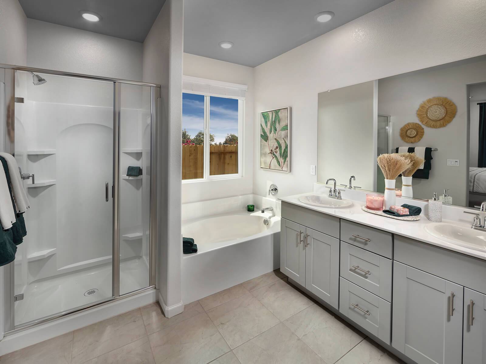 Spacious bathrooms with double sinks make mornings a little easier.