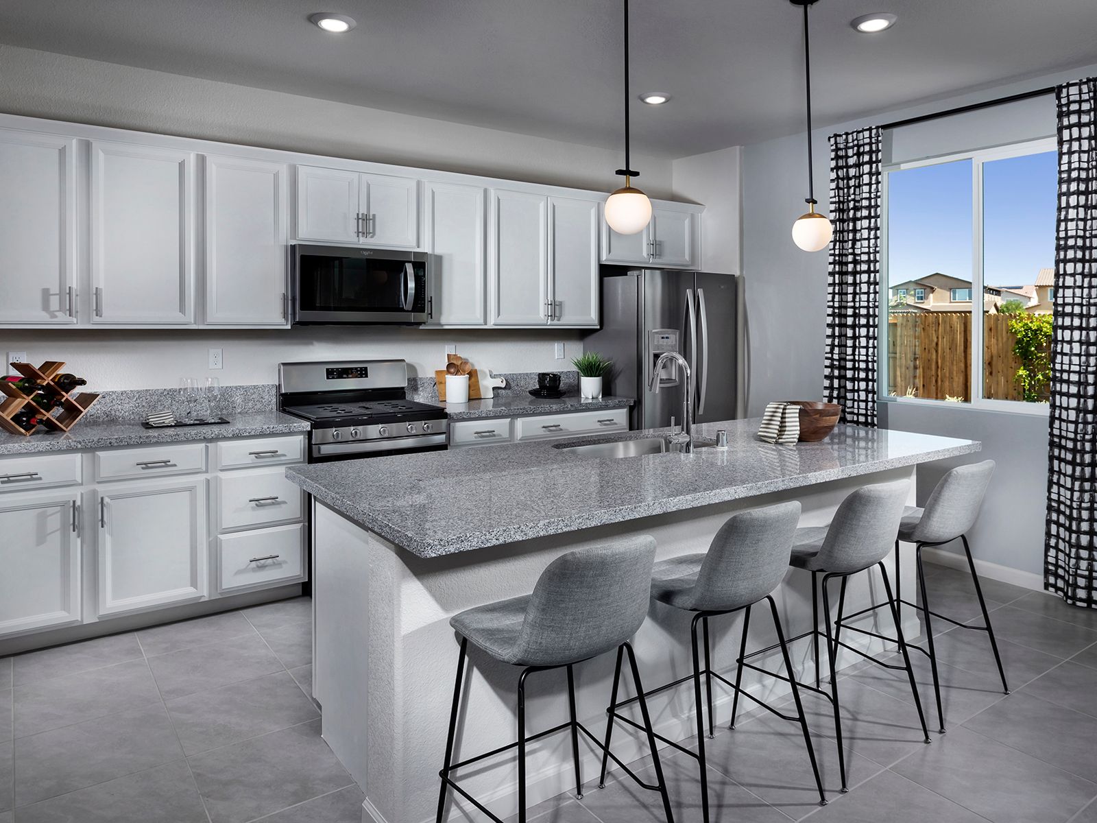 Enjoy cooking meals while keeping an eye on the kids playing in the backyard.