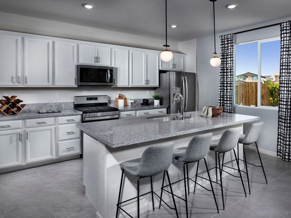 Enjoy cooking meals while keeping an eye on the kids playing in the backyard.