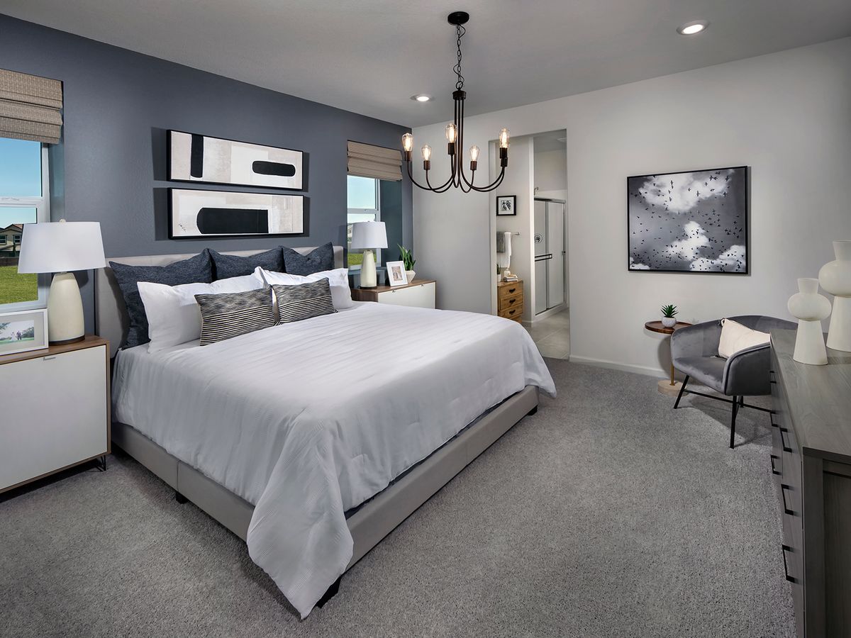 Retreat to the spacious primary suite at the end of the day.