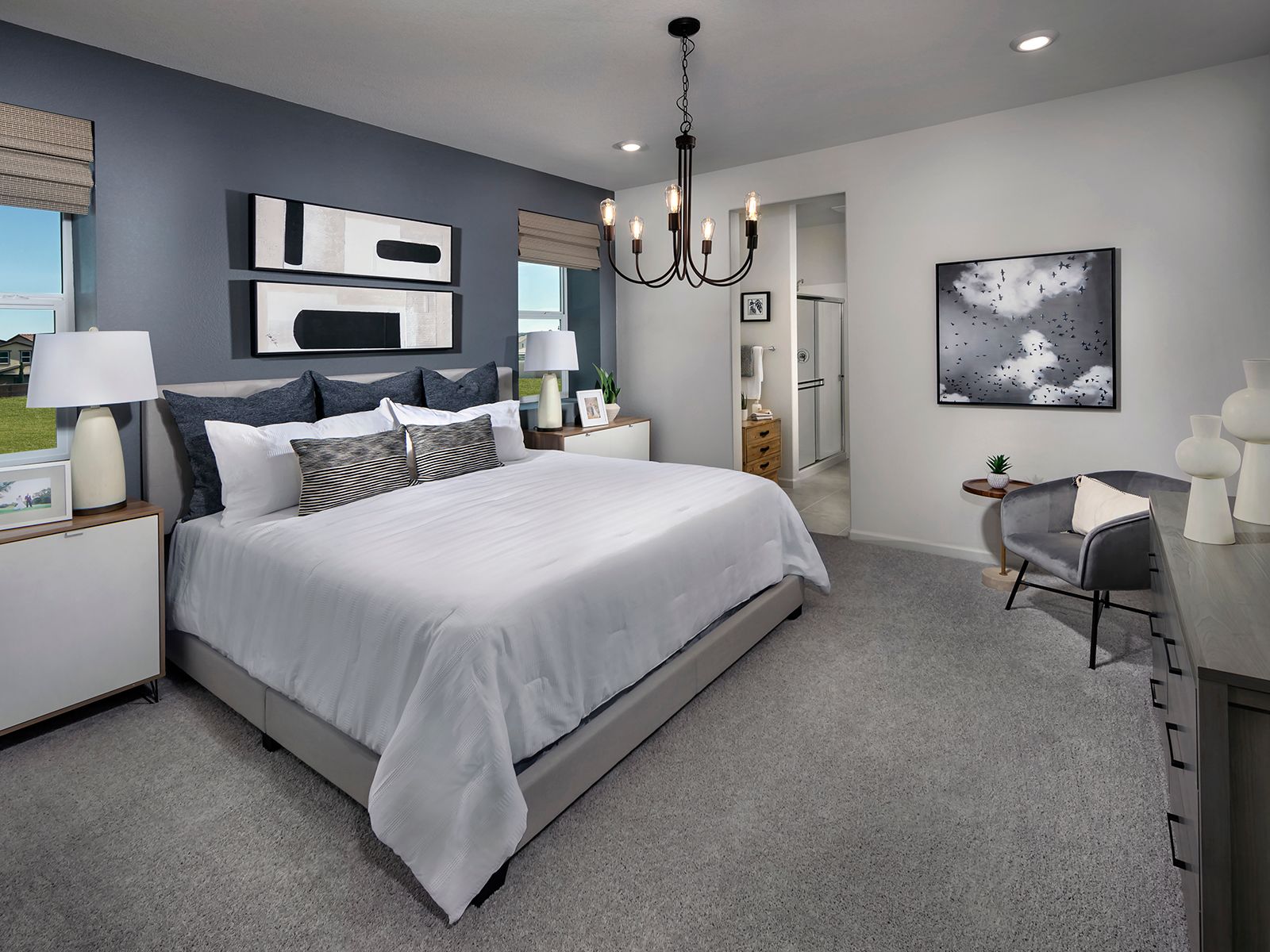 Retreat to the spacious primary suite at the end of the day.