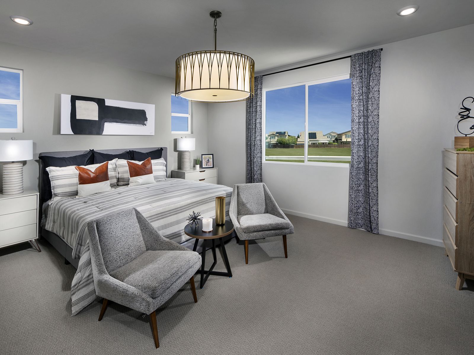 Residence 4 primary bedroom modeled at a nearby Meritage community.