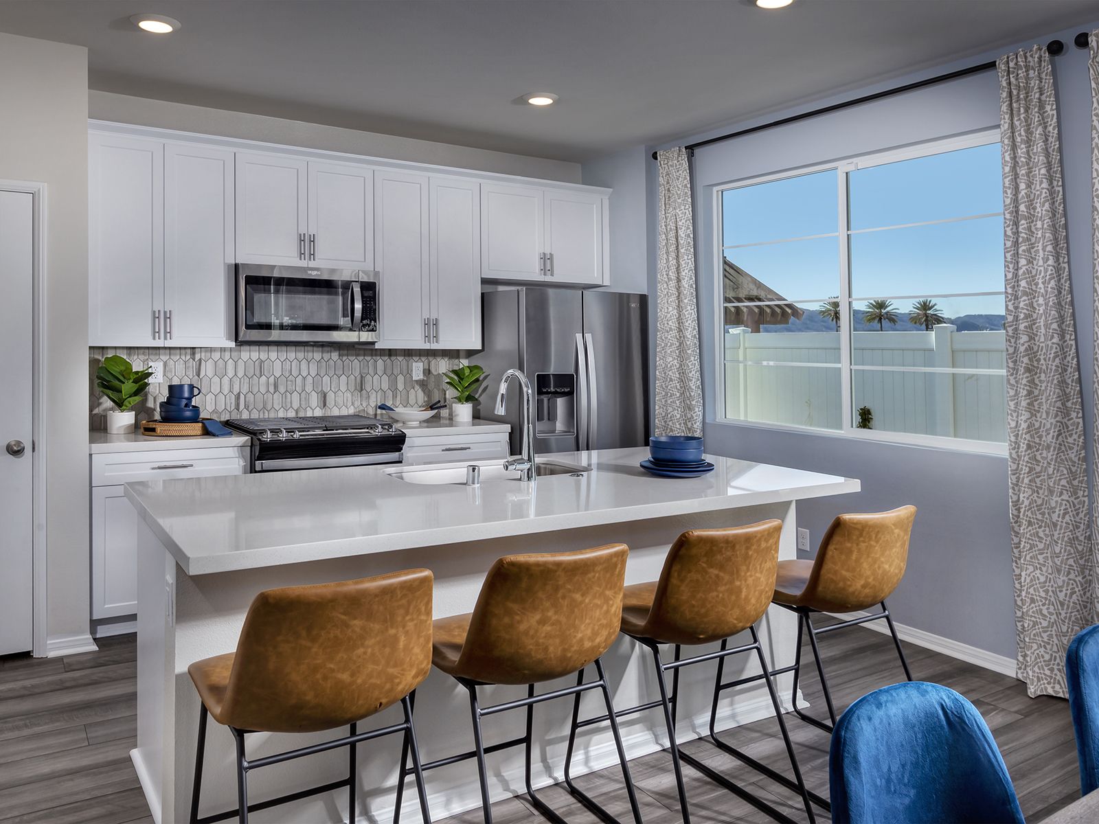 Prepare meals while kids finish homework on the spacious island.