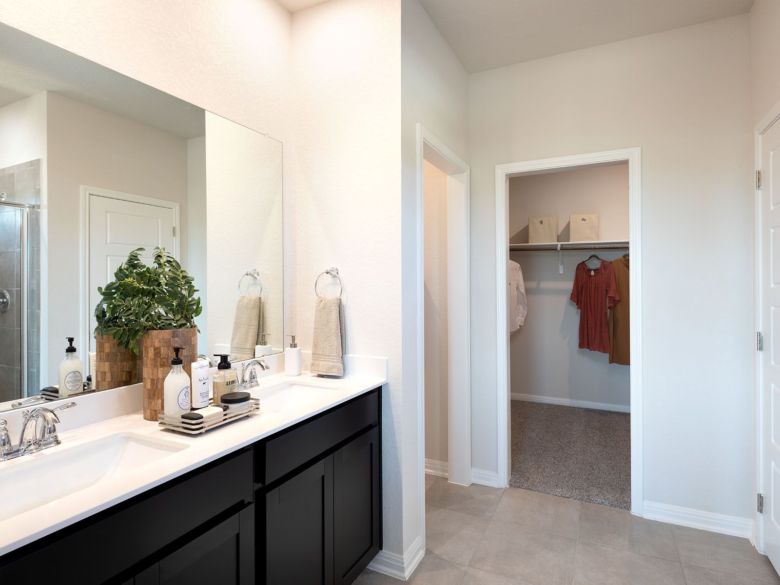 The luxurious primary suite boasts a huge walk-in closet.