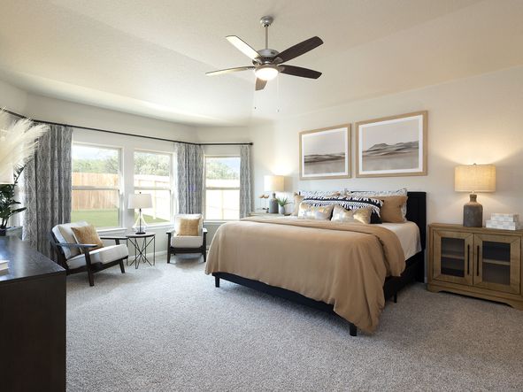 Enjoy a private primary suite tucked away in the back of the home.