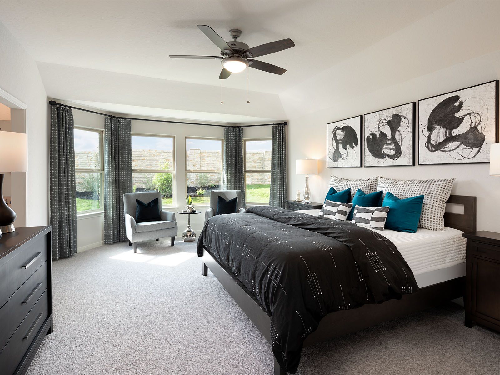 Enjoy a private primary suite tucked away in the back of the home.