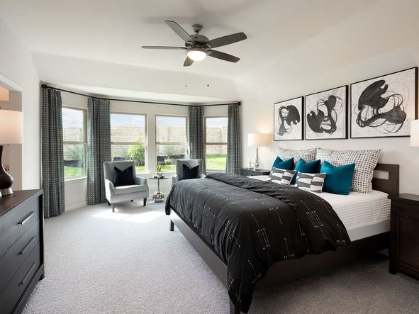 Enjoy a private primary suite tucked away in the back of the home.