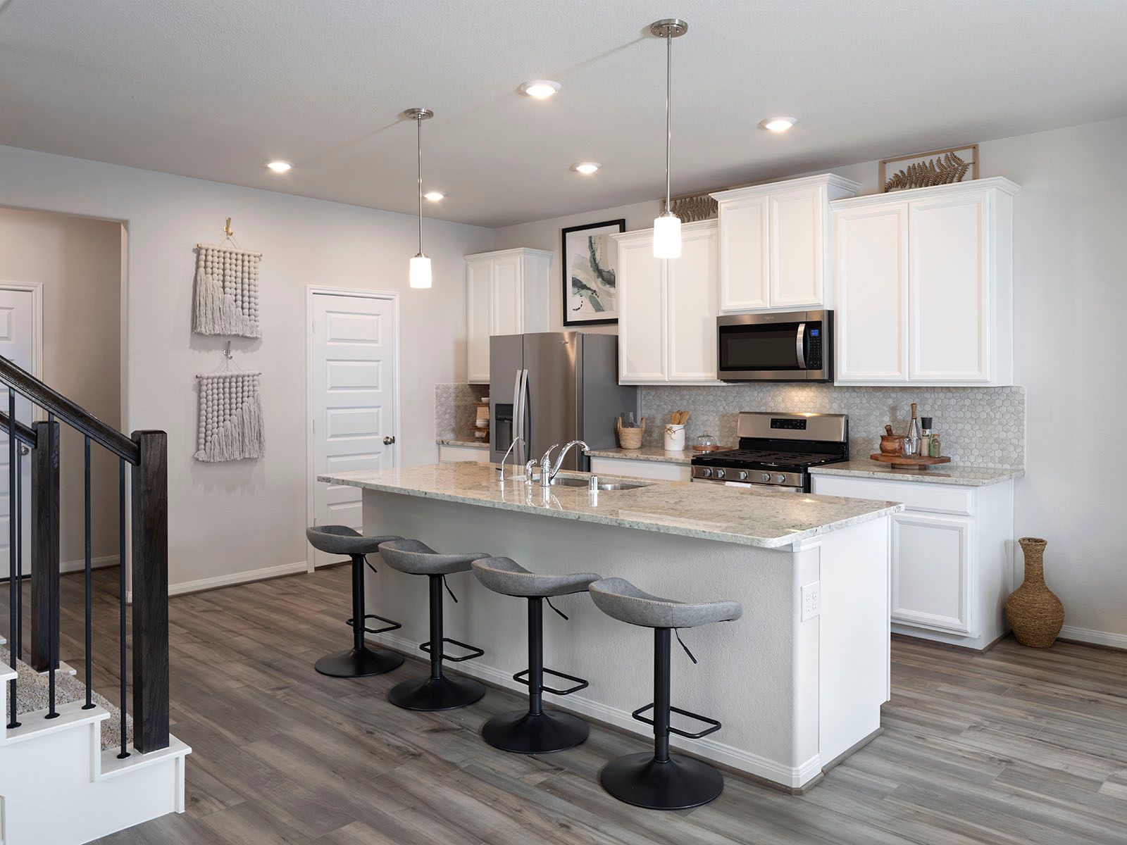 Prep dinner without missing a moment in this open concept.