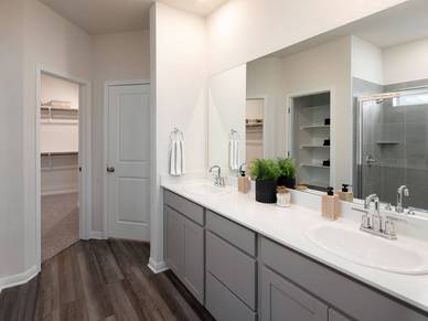 A perfect, spacious bath with dual sinks and an extra-large shower.