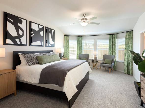 Sleep will come easy in this tranquil primary suite.