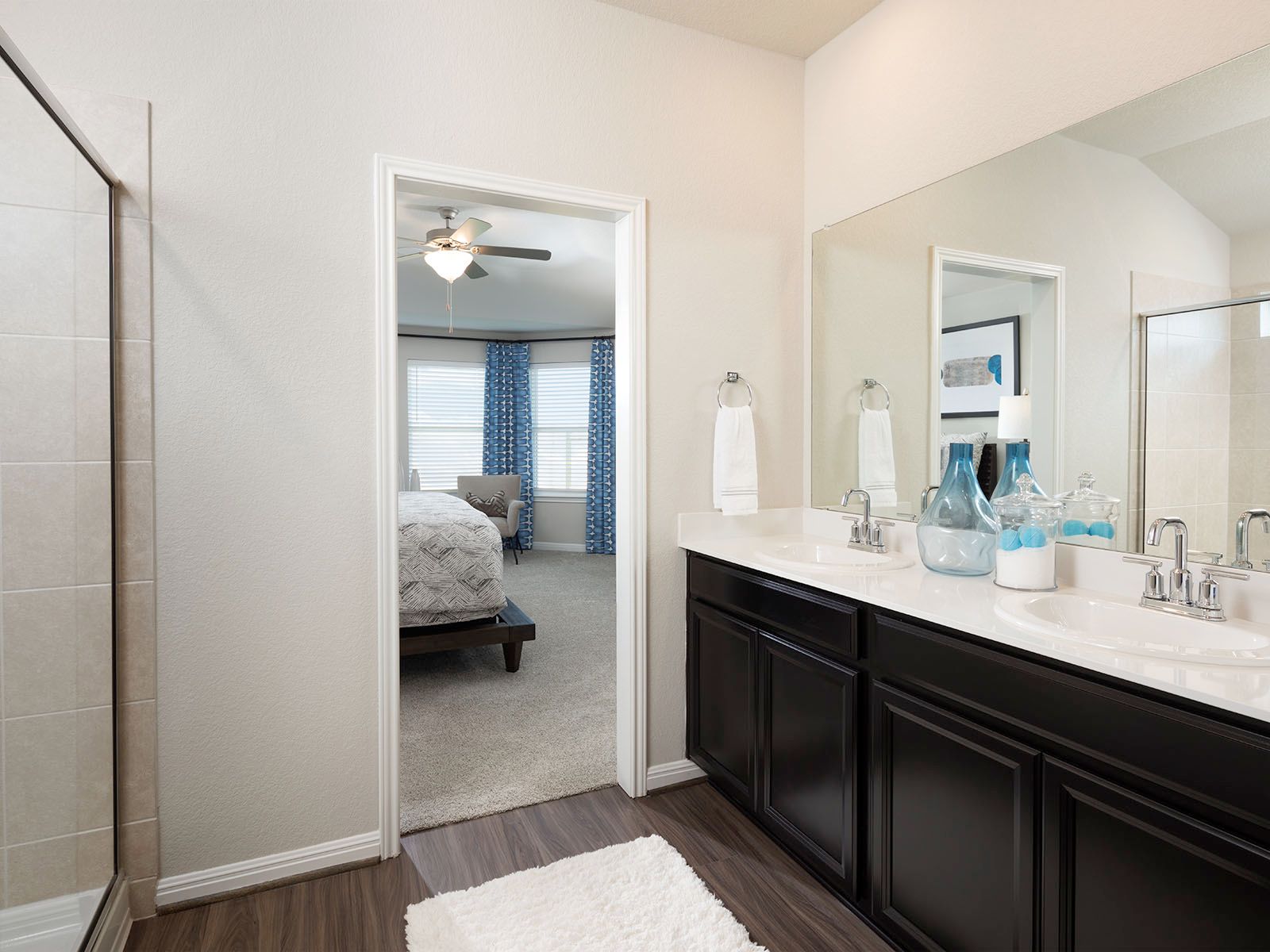 Enjoy dual sinks and oversized walk-in showers in your new primary bathroom.