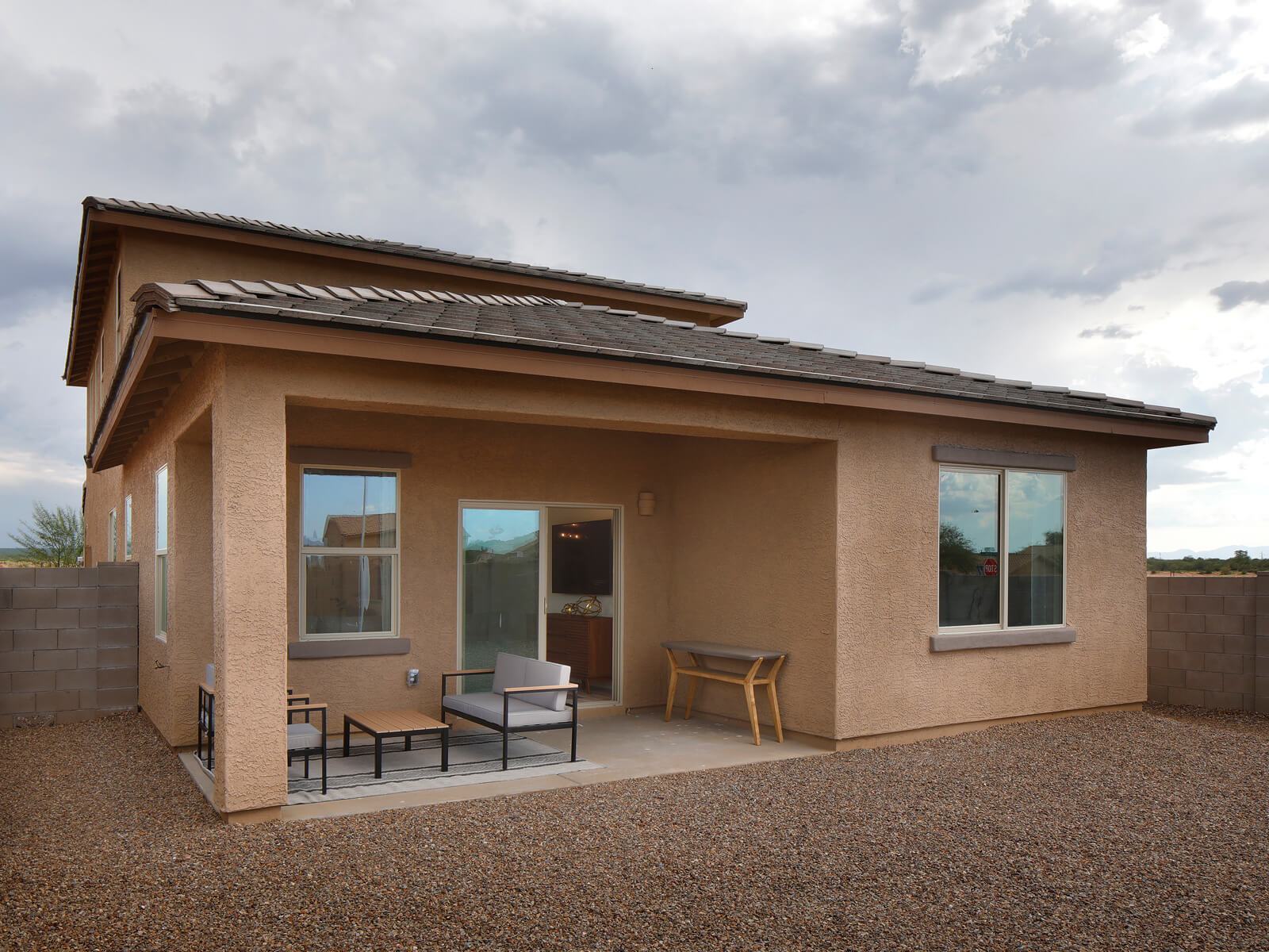 The covered back patio is perfect for afternoon BBQs.