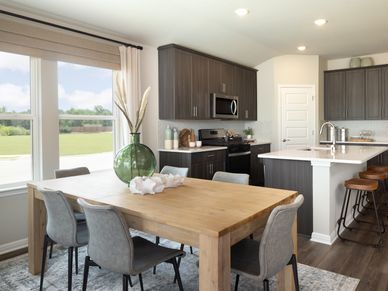 The cozy dining area is a great space open to the kitchen and great room.
