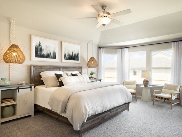 Relax after a long day in the gorgeous primary suite.