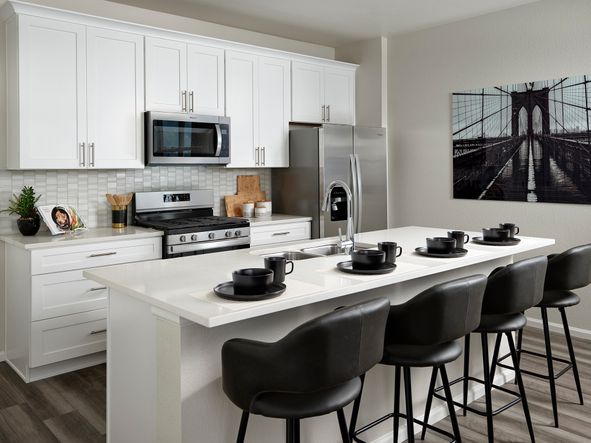 Welcome to the Woodland floorplan modeled ay Horizon Uptown in Aurora, CO.