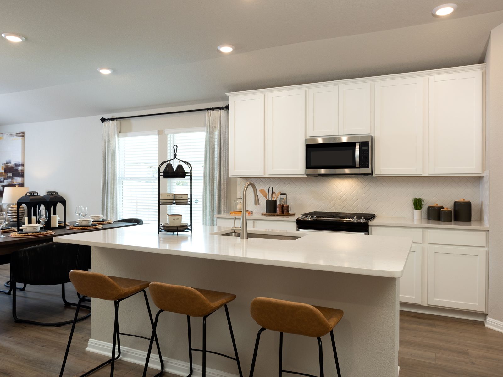 The Divine interior package features off-white quartz countertops and brown grey EVP flooring.