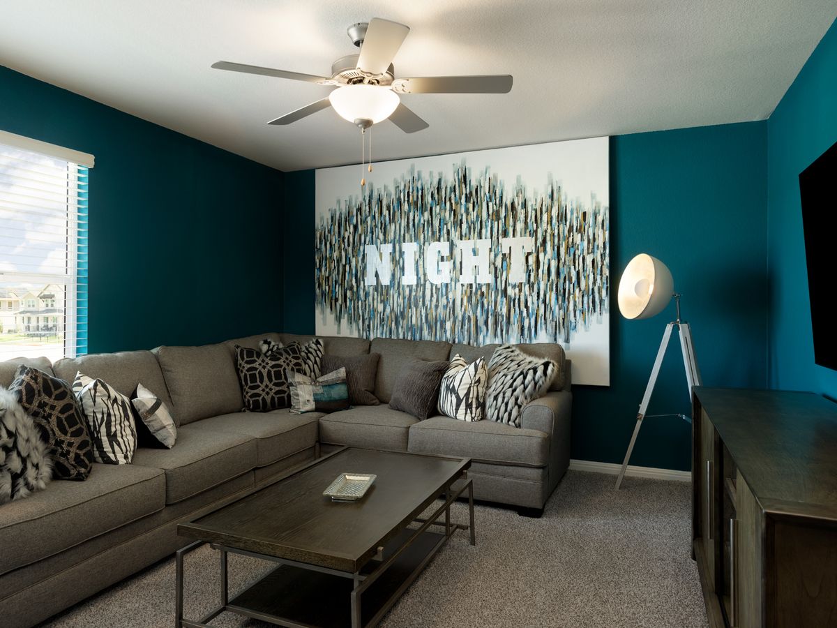 Use the upstairs media room to make the home your own.