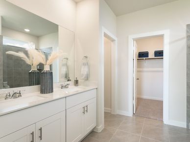 Unwind in your tranquil primary bathroom.