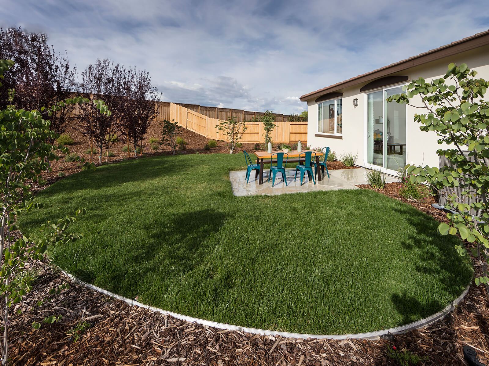 Residence 1 backyard exterior modeled at a nearby Meritage community.