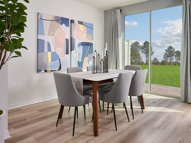 Dining room in the Oakville floorplan at The Meadow at Crossprairie
