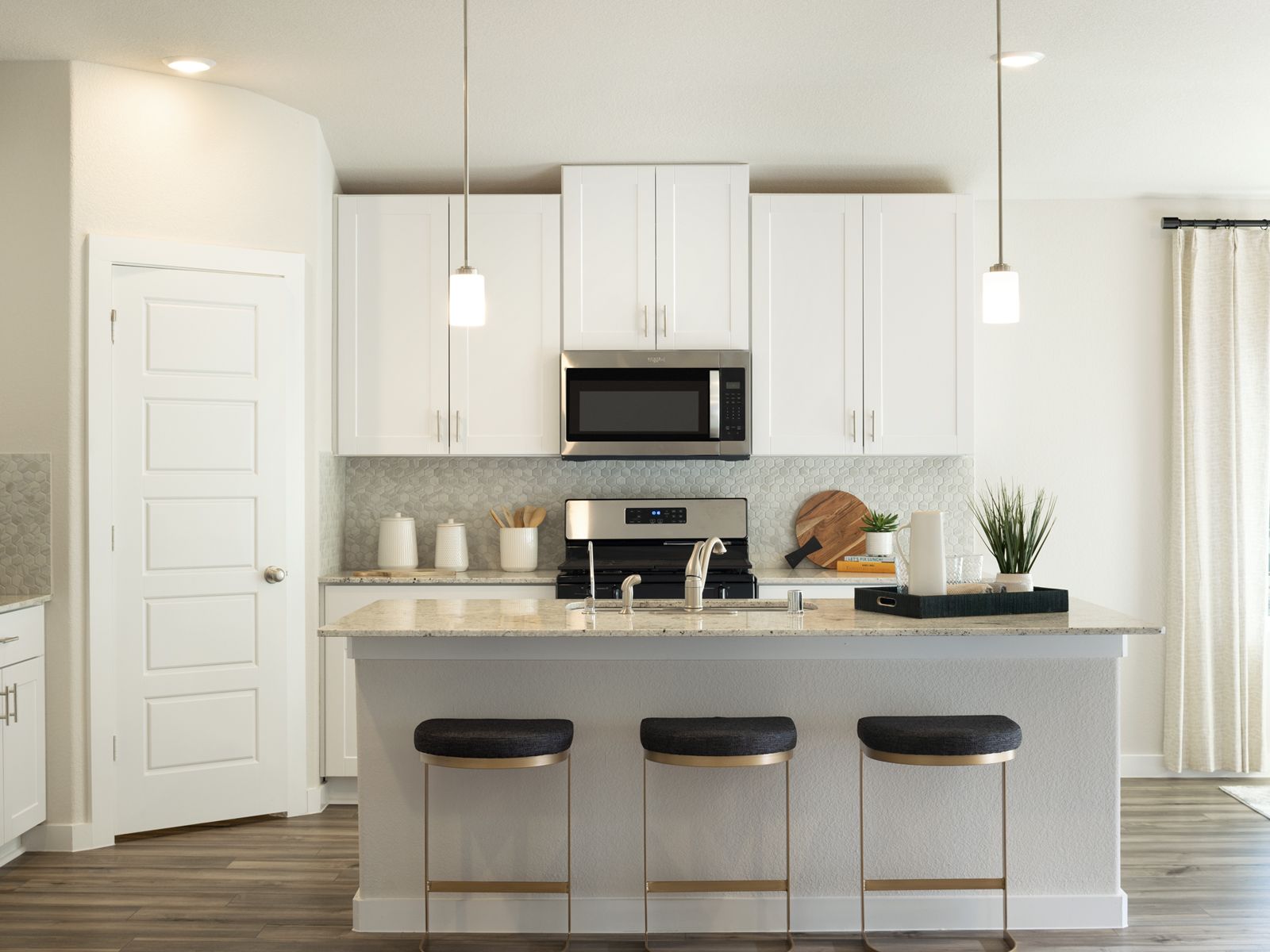 Prep dinner without missing a moment in this open concept.