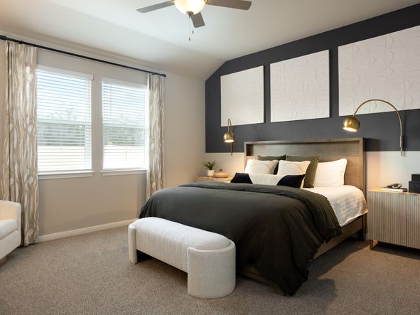Retreat to the primary bedroom at the end of a long day.