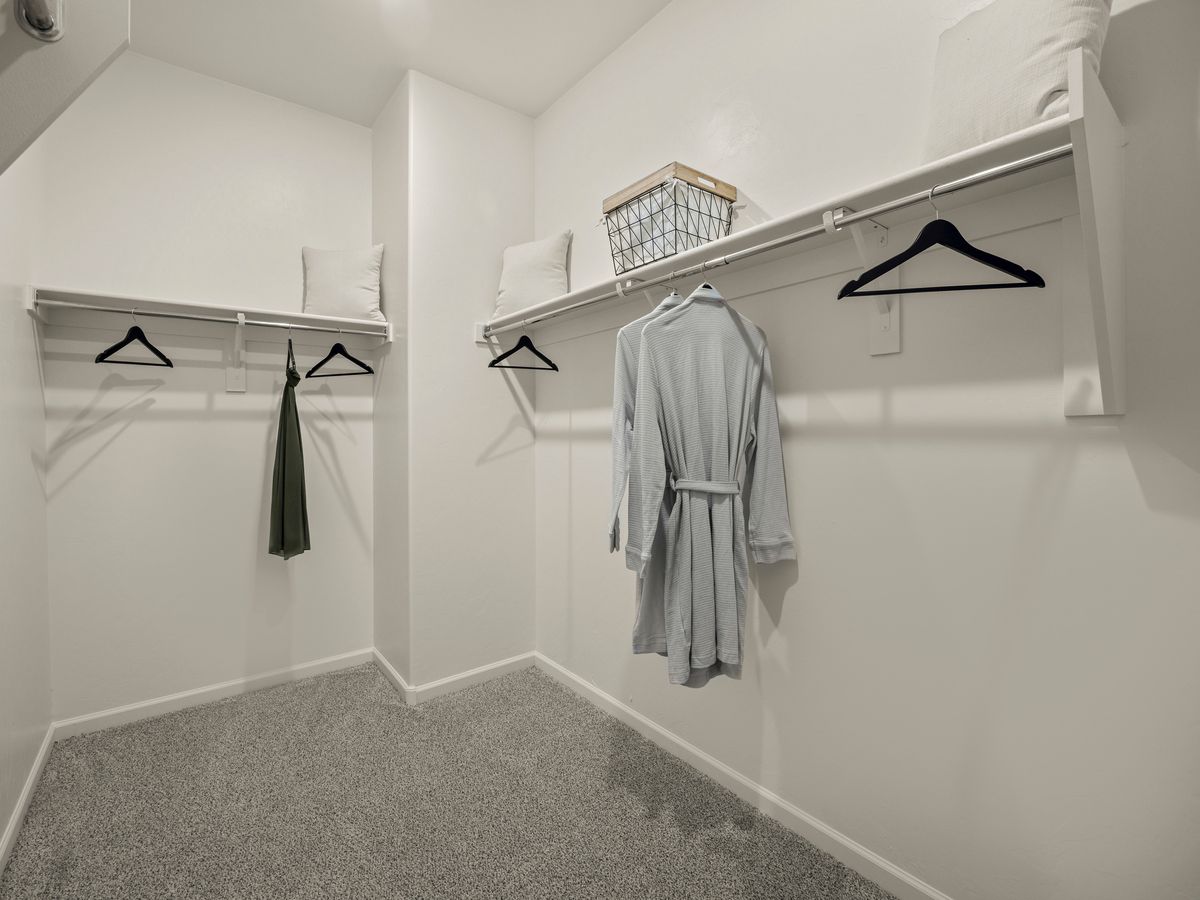 The primary bathroom also boasts a walk-in shower, oversized closet and linen storage.