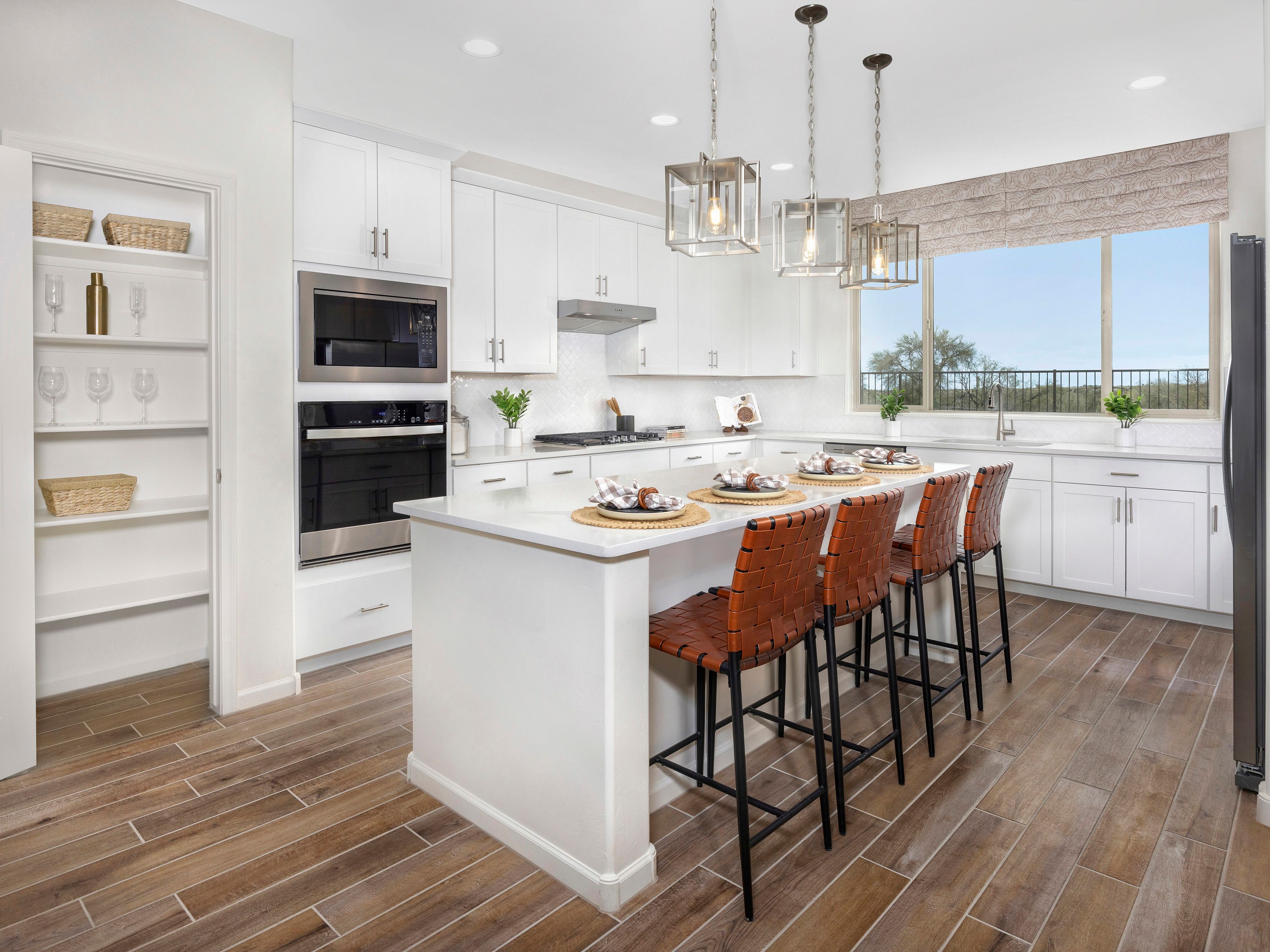 Kitchen in the Palo Verde floorplan at Arbor at Madera Highlands.