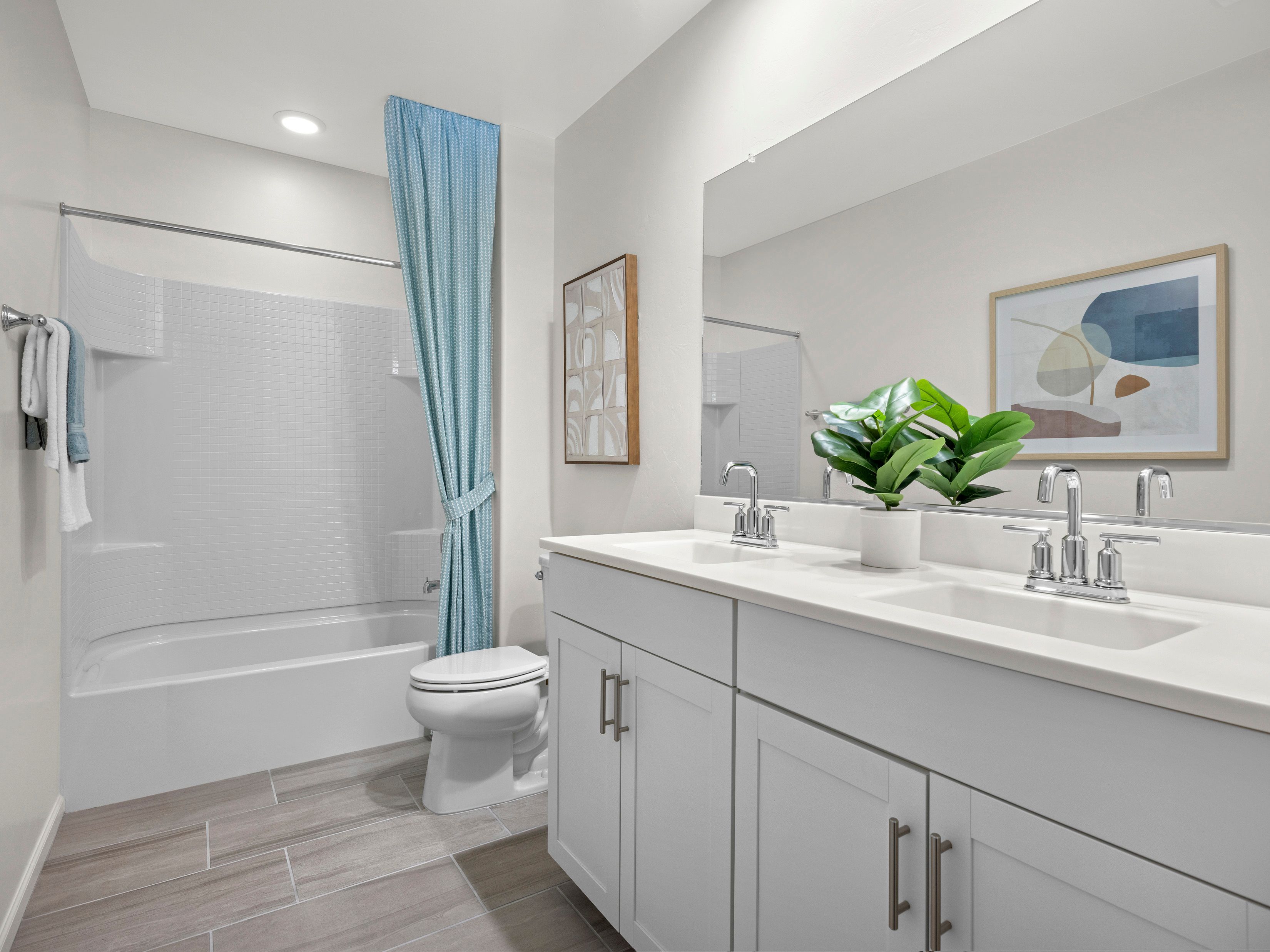 Upstairs bathroom with dual sinks.